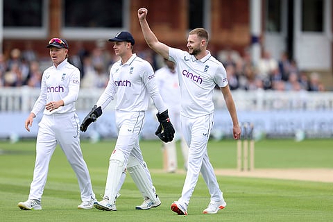Gus Atkinson celebrates the wicket of Alzarri Joseph